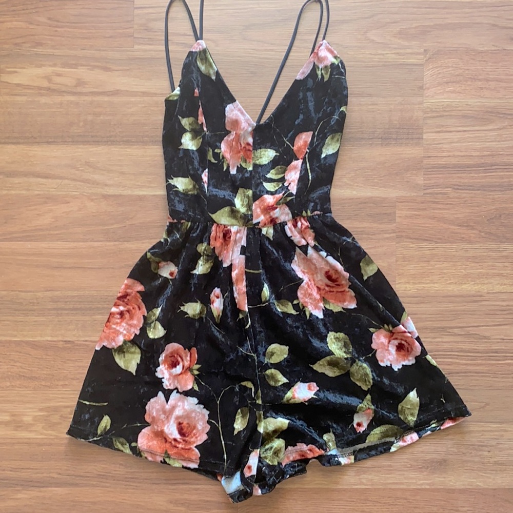 New with tags. Tilly’s romper, black with roses. Size medium, fits like a small.